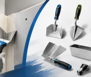 A technical overview of specialized drywall corner tools featuring a professional using an inside corner trowel to embed tape and smooth compound, alongside a collection of corner finishers, a mud pan, and an adjustable corner applicator.
