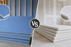 Blog featured image comparing blueboard vs sheetrock, showing a side-by-side stack of blue veneer plaster baseboards next to a stack of standard grey regular drywall panels with closeup circular swatches of their distinct surface layers.